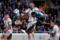 Club Brugge's Nigerian forward David Chidozie Okereke (2R) heads the ball next to Galatasaray's Dutch forward Ryan Babel (C) and Galatasaray's Colombian forward Radamel Falcao (L). (AFP Photo)
