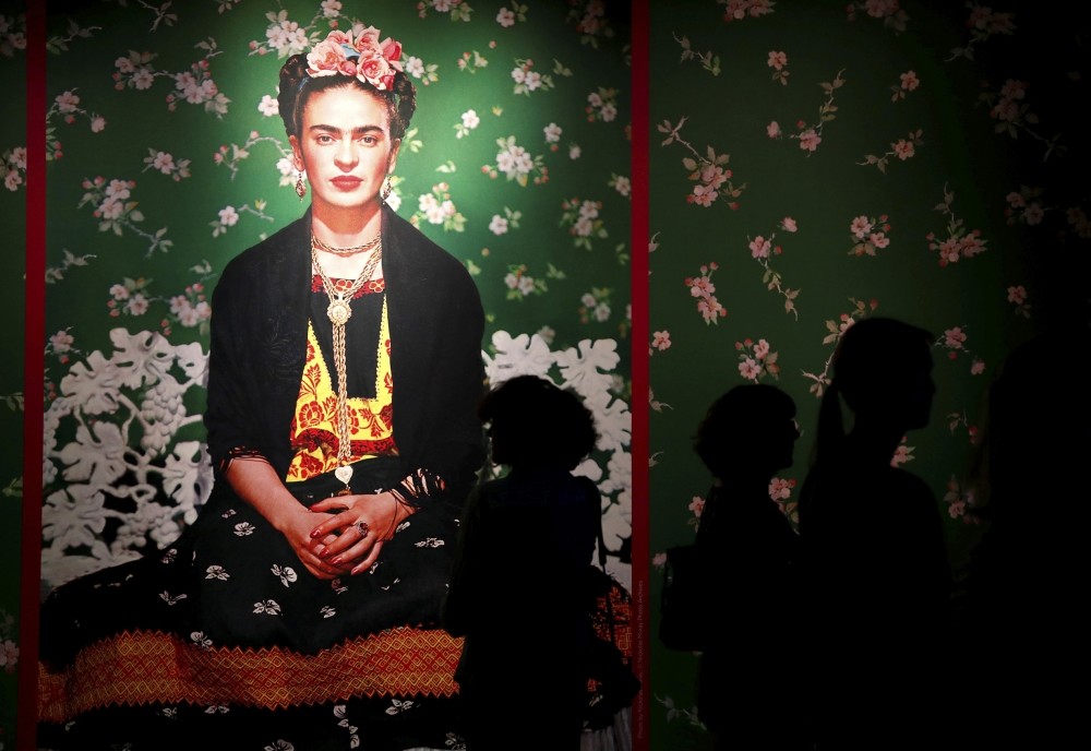 Visitors attend the u201cFrida Kahlo: Masterpieces from the Museo Dolores Olmedo, Mexico Cityu201d exhibition at the Hungarian National Gallery in Budapest.