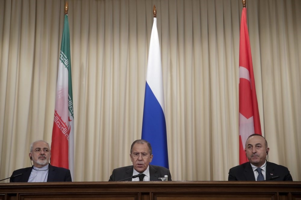 Iranian Foreign Minister Mohammed Javad Zarif (L), Russian Foreign Minister Sergey Lavrov (C) and Turkey's Foreign Minister Mevlu00fct u00c7avuu015fou011flu at a joint news conference after their talks of in Moscow. 