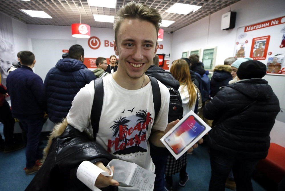 Customers buy the new iPhone X at M.video store in Moscow. Apple's new iPhone X goes on sale in more than 55 countries and territories on Friday.