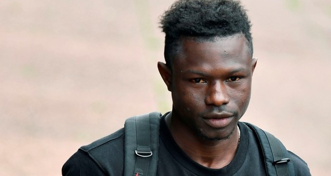 Malian migrant Mamoudou Gassama arrives to receive his temporary residence permit at the Prefecture of Bobigny, northeast of Paris on May 29, 2018. (AFP Photo)