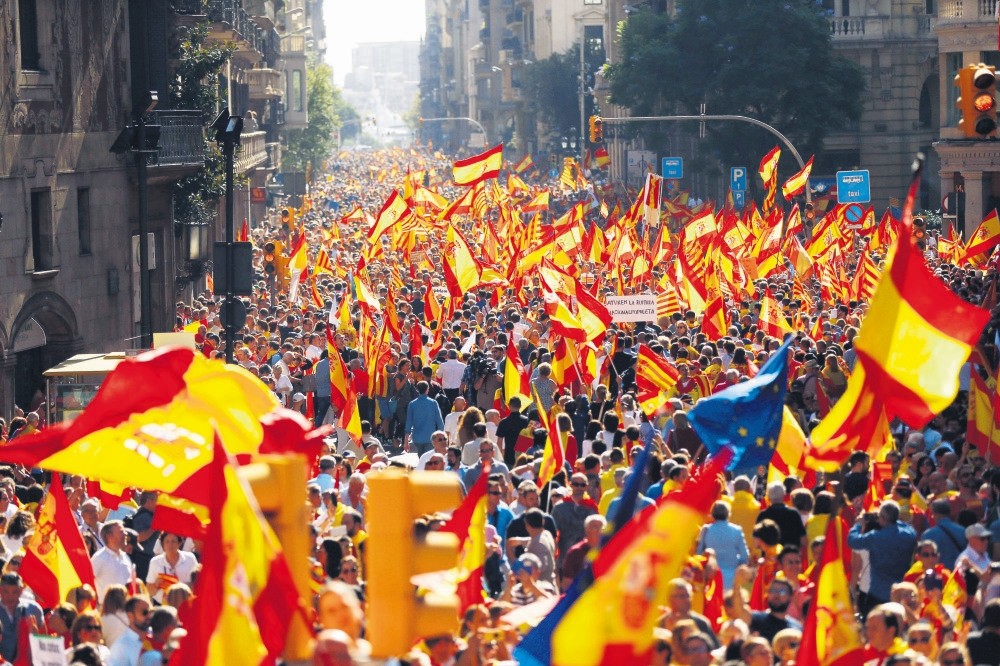 Thousands of people march to protest the Catalan government's push for secession from the rest of Spain, Barcelona, Oct. 8. 