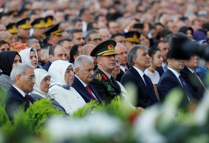 Former Prime Minister Binali Yıldırım, 4th left, Hulusi Akar, center, Chief of the General Staff, and Abdullah Gül, Turkey's former President, center right, attend a ceremony for President Recep Tayyip Erdoğan, in Ankara, Turkey, Monday, July 9, 2018.