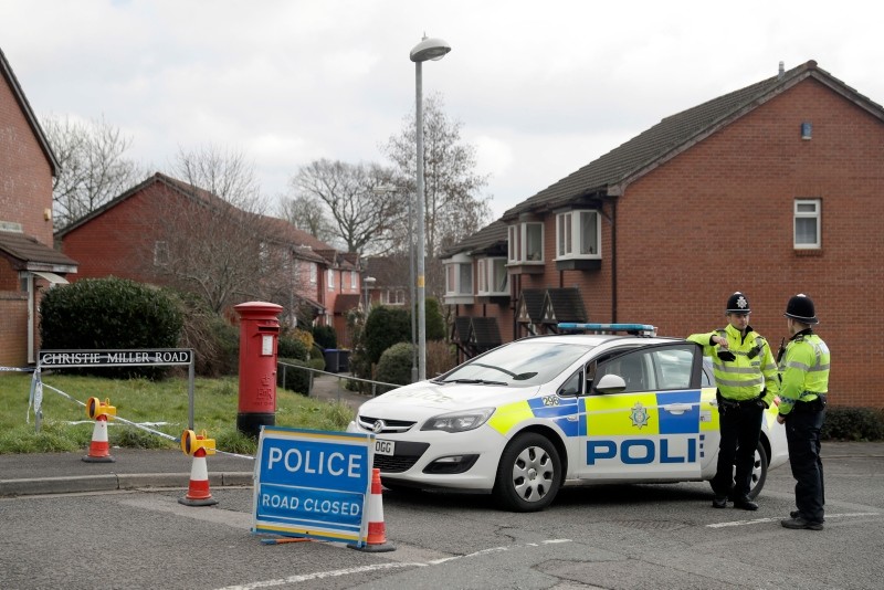 In this Tuesday, March 13, 2018 file photo, police officers stand guard at the bottom of the road where poisoned former Russian double agent Sergei Skripal lives in Salisbury, England. (AP Photo)