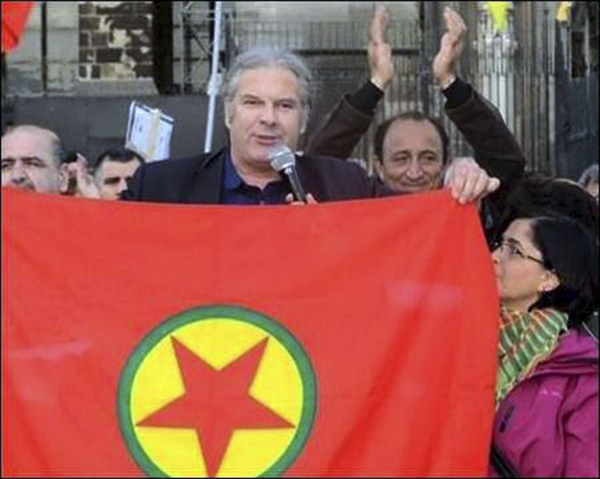 This file photo shows Andrej Hunko holding the banner of the PKK, which is listed as a terrorist group by Turkey and Germany.