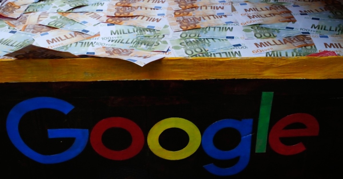 A trunk full of fake bank notes is displayed as activists from anti-globalization organisation Attac stage a protest at Google's Paris headquarters to criticize the company's tax evasion policies (AP File Photo)