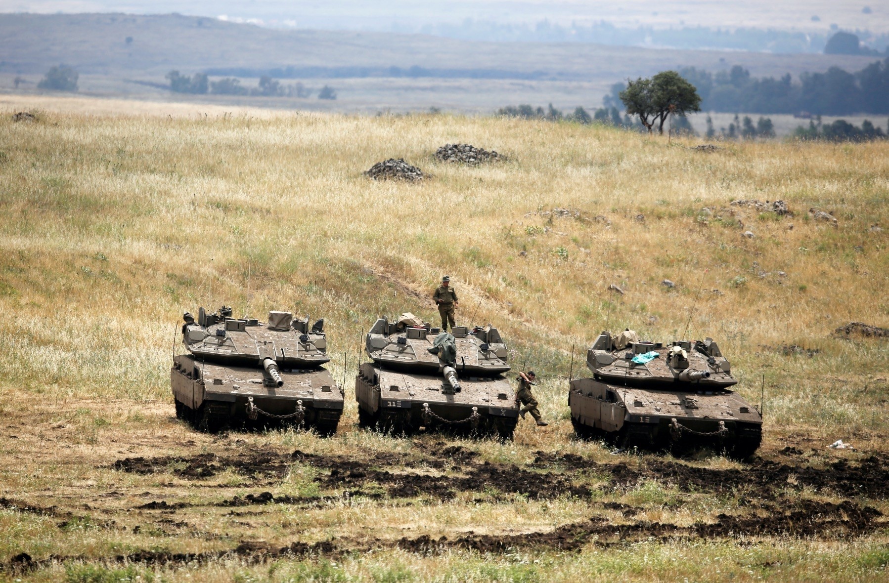 An Israeli soldier stands on a tank near the border with Syria in the Israeli-occupied Golan Heights, May 9.