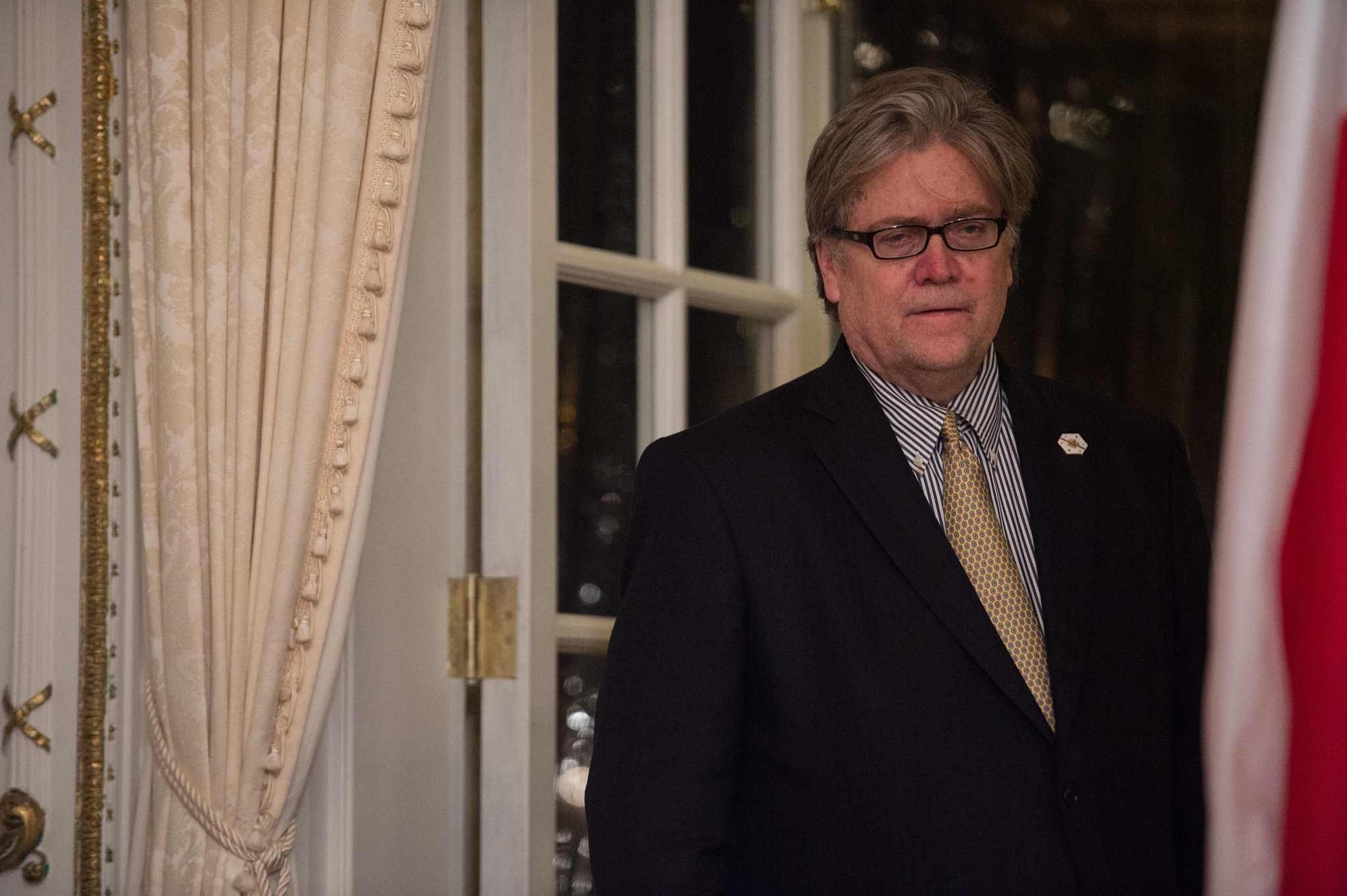 Steve Bannon, then US President Donald Trump's chief strategist, standing aside at Trump's Mar-a-Lago resort in Palm Beach, Florida. (AFP Photo)