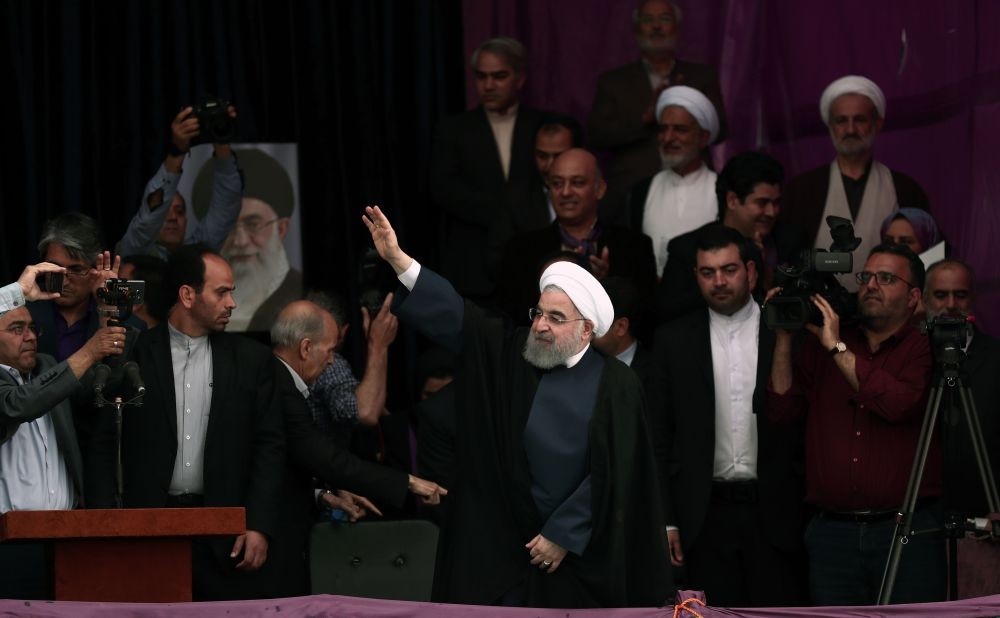 Hassan Rouhani greeting his supporters at a campaign rally ahead of the presidential elections at the Takhti stadium in the northeastern city of Mashhad, May 17. 