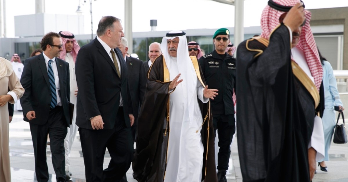 U.S. Secretary of State Mike Pompeo, centre left, walks with Saudi Foreign Minister Ibrahim Abdulaziz Al-Assaf, as Pompeo arrives in Jeddah, Saudi Arabia, Monday, June 24, 2019. (AP Photo)