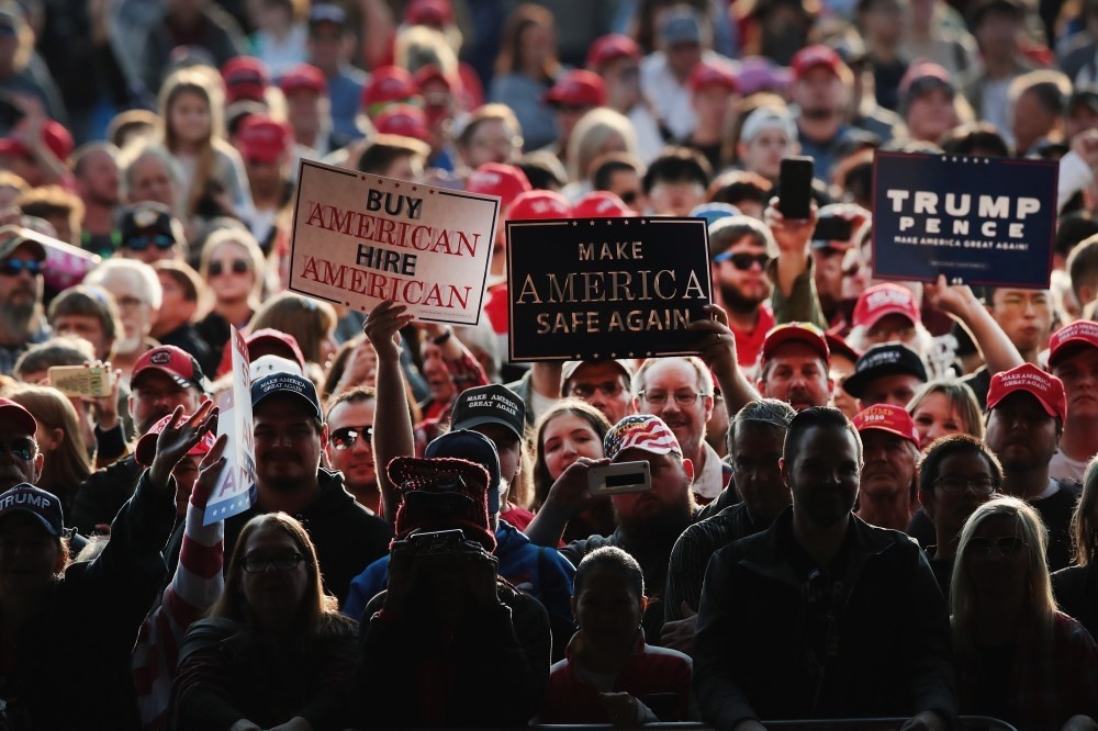 Supporters await the arrival of President Donald Trump at a rally for the upcoming midterm elections, at the Southern Illinois Airport, Murphysboro, Illinois, Oct. 27.