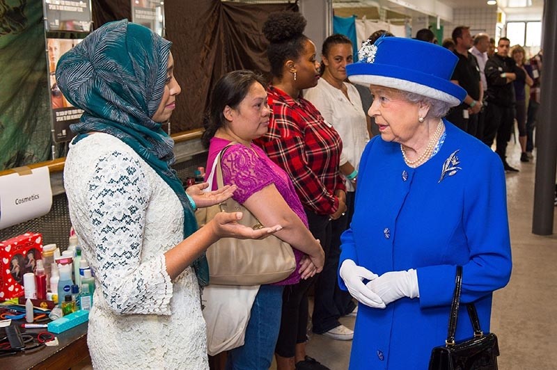 Britain's Queen Elizabeth II meets members of the community affected by the Grenfell Tower disaster during a visit to the Westway Sports Centre (AFP Photo)
