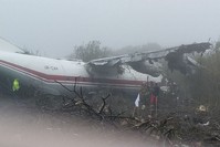 This handout photograph taken and released by The Ukrainian Emergency Ministry shows rescuers as they work at the plane crash site in a forest outside Lviv on October 4, 2019. (AFP Photo)