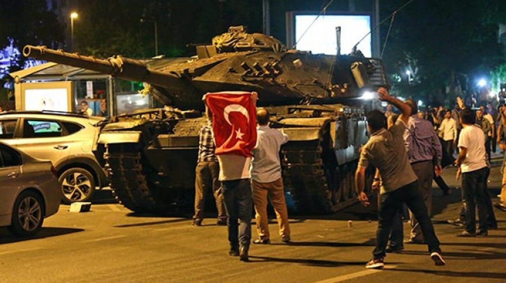 People confront a tank controlled by putschists in Istanbul on July 15, 2016.