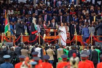 Kenyan President Uhuru Kenyatta, center, is sworn-in accompanied by his wife Margaret, center-right, during his inauguration ceremony at Kasarani stadium in Nairobi, Kenya, Nov. 28, 2017. (AP Photo)