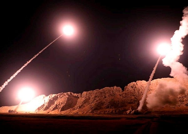 In this photo released on Monday, Oct. 1, 2018, by the Iranian Revolutionary Guard, missiles are fired from city of Kermanshah in western Iran targeting DAESH terrorists in Syria. (AP Photo)