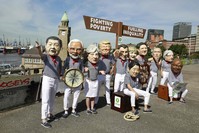 Activists protest against world leaders ahead of the G20 Summit held in Hamburg, Germany, July 6, 2017. 