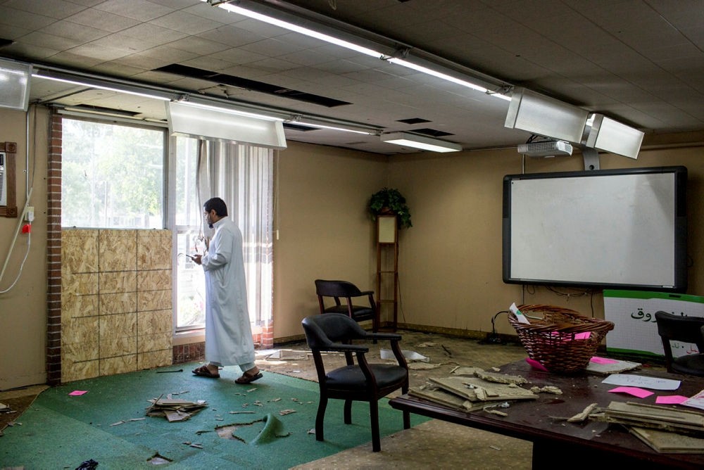 Asad Zaman stands at the site of the bombing in the Dar Al Farooq Islamic Center on Monday, Aug. 7, 2017, in Bloomington, Minn. (Star Tribune via AP)