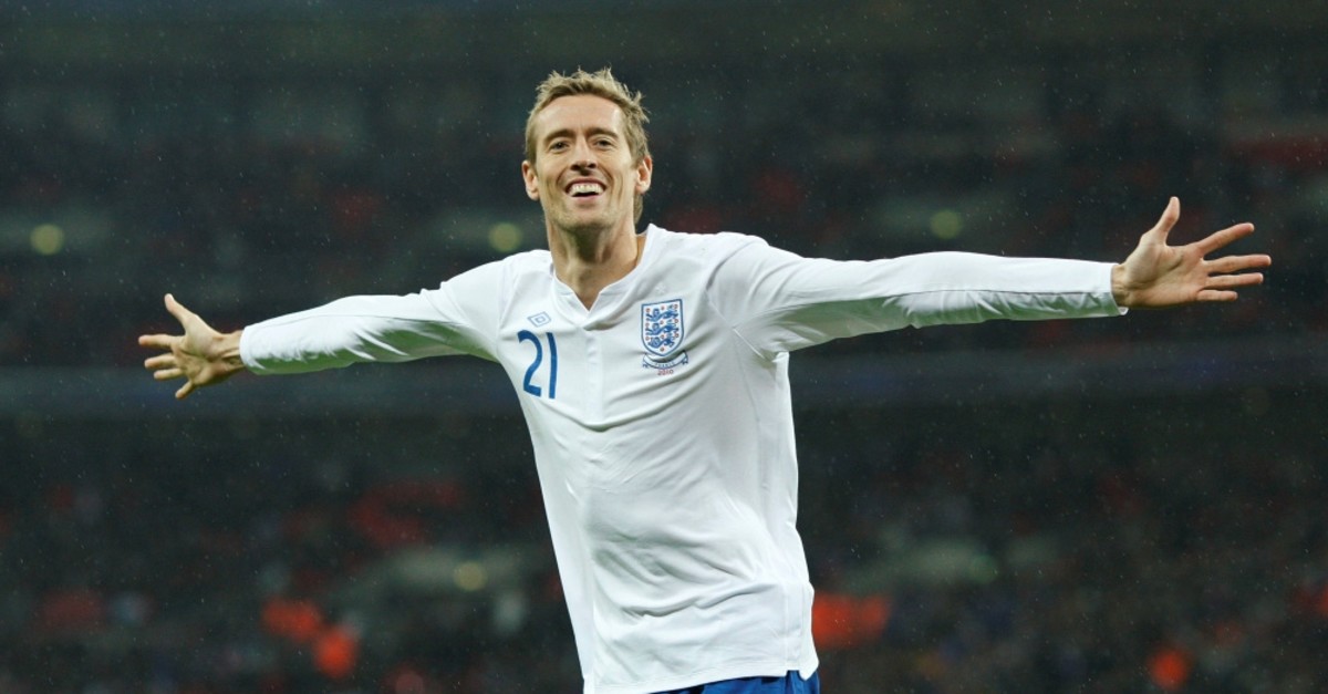 Peter Crouch celebrates scoring the first goal for England against France, Nov. 17, 2010.