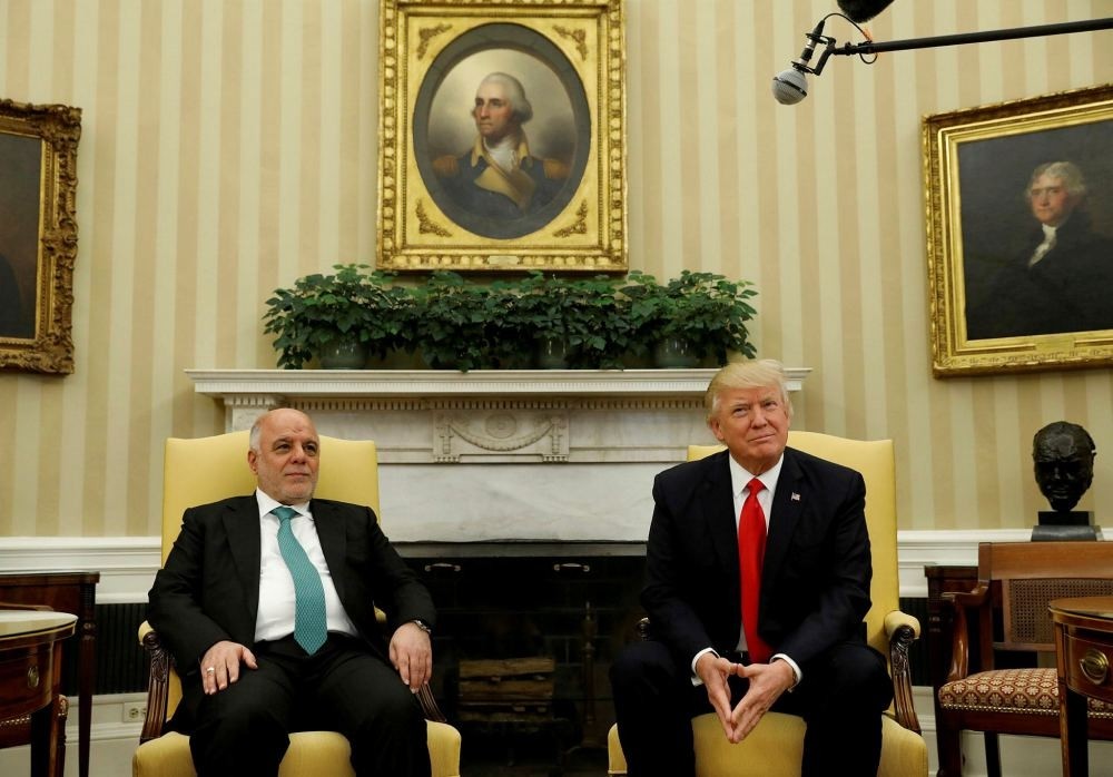 U.S. President Donald Trump meets with Iraqi Prime Minister Haider al-Abadi at the White House in Washington, March 20.