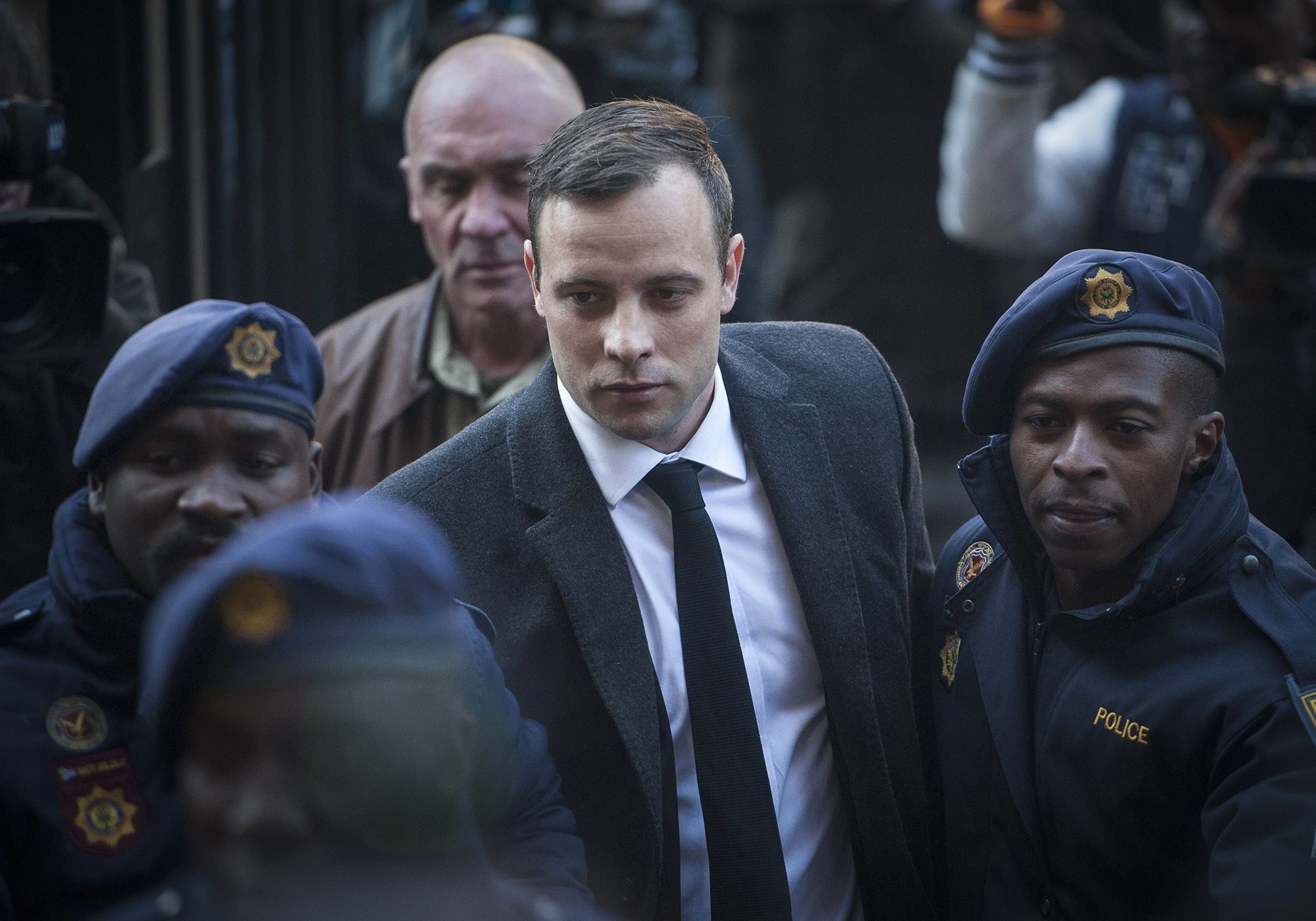 Oscar Pistorius, center, arrives at the High Court in Pretoria, South Africa Wednesday, July 6, 2016. (AP Photo)