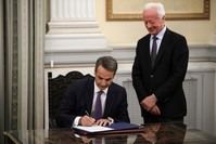 Greece's new Prime Minister Kyriakos Mitsotakis signs a document during a swearing-in ceremony at the Presidential Palace, Athens, July 8, 2019.