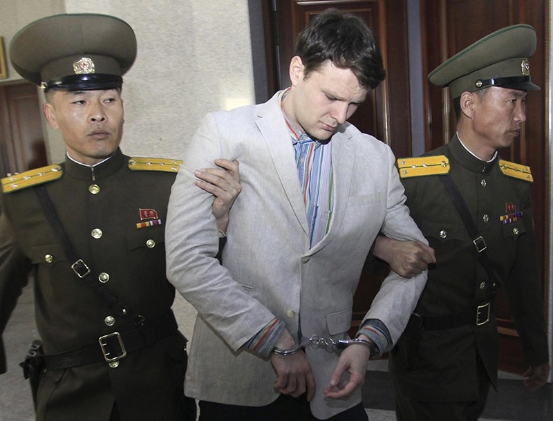 In this March 16, 2016, file photo, American student Otto Warmbier, center, is escorted at the Supreme Court in Pyongyang, North Korea. (AP Photo)