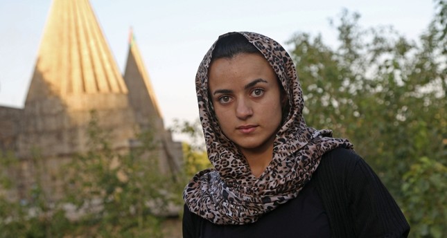 Yazidi woman Ashwaq Haji, allegedly used by Daesh as a sex slave, visits the Lalish temple in tribute to the terrorists' victims from her village of Kocho near Sinjar, in Lalish, northern Iraq, on August 15, 2018. (AFP Photo)