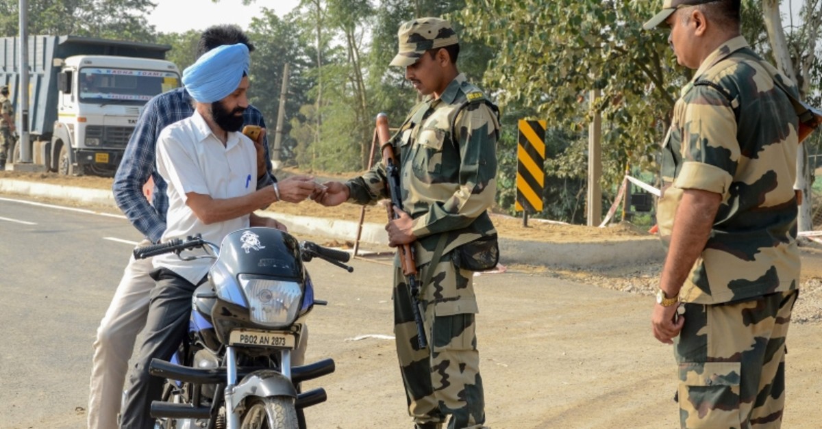 Border Security Force (BSF) personnel check identity documents of motorcyclists at Dera Baba Nanak, 50 kilometers from Amritsar, India, Oct. 24, 2019. (AFP Photo)