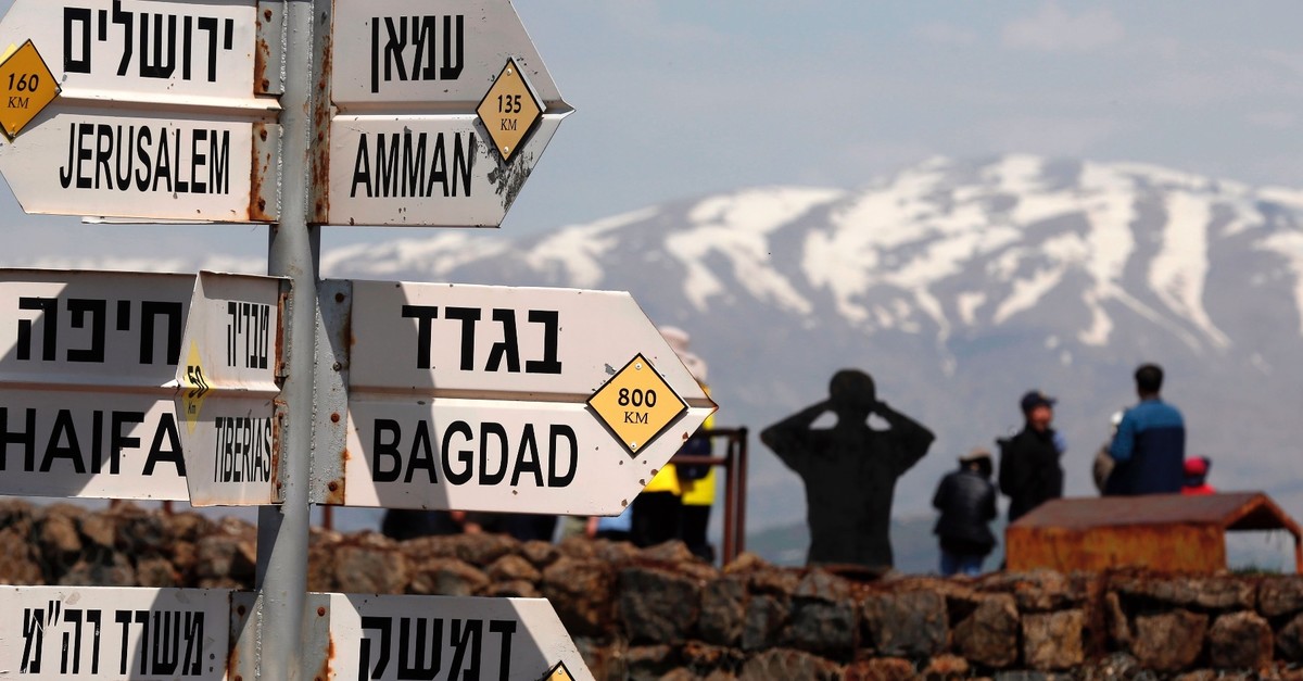 A sign for tourists shows the direction to Jerusalem, Amman, Baghdad and Damascus among other destinations at an army post on Mount Bental in the Israeli-annexed Golan Heights, March 22, 2019.