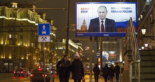 صورة دعائية للانتخابات الرئاسية المقبلة في روسيا ap