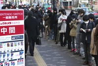 Shoppers line outside of retail store Bic Camera to buy Nintendou2019s newest computer game u201cSwitchu201d in central Tokyo. (AP Photo)