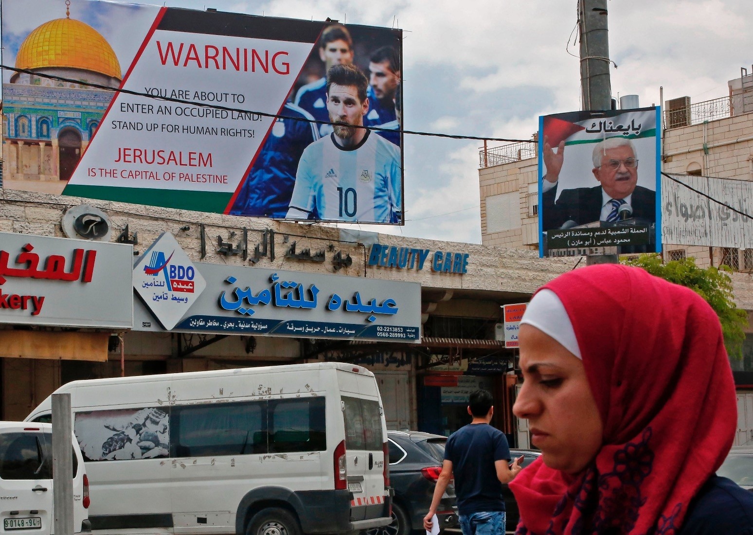 A poster is erected on a main street in the West Bank town of Hebron, denouncing the planned friendly football match between Argentina and Israel, and calling Argentinau2019s star Lionel Messi (portrait) to boycott the match.