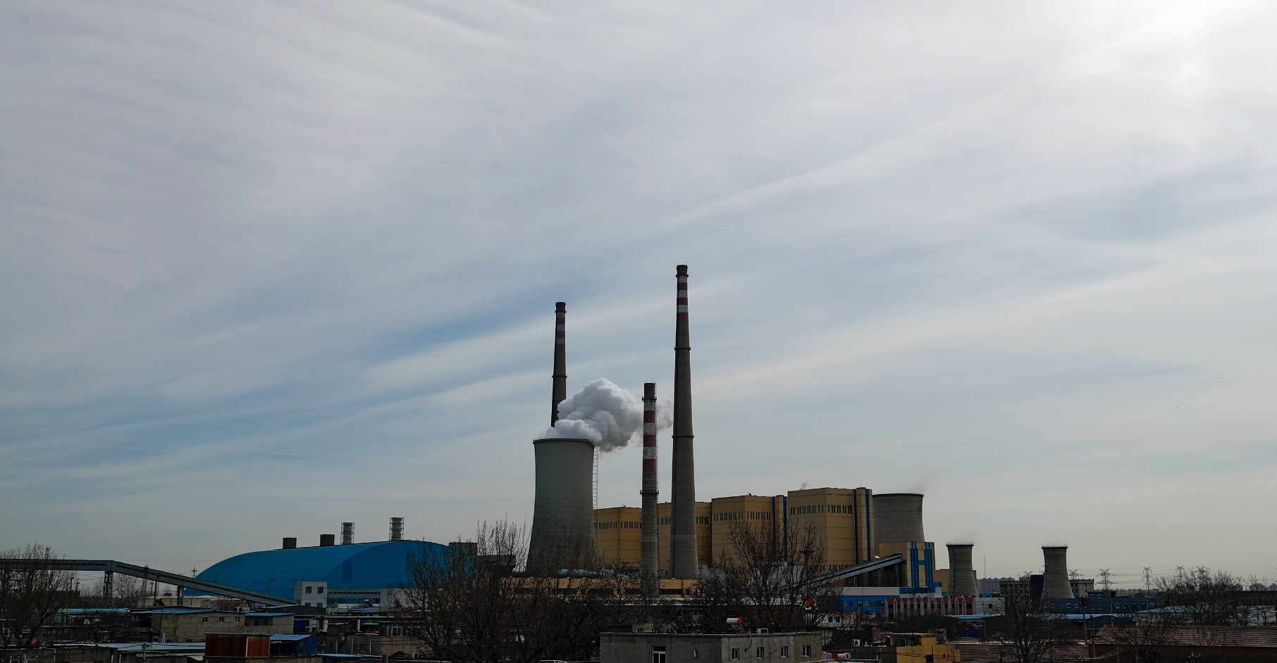 White smoke and steam rise from the China Huaneng Groupu2019s Beijing power plant, the last coal-fired plant to shut down on March 18, as the Chinese capital converts to clean energy like thermal power.