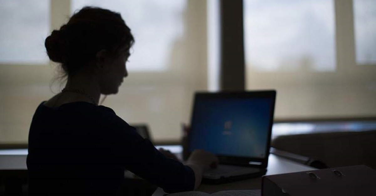 An employee working on her computer. (AA Photo)