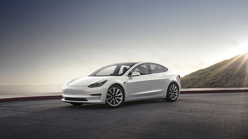 This photo provided by Tesla shows the 2017 Tesla Model 3, a compact electric sedan that offers two levels of range. It's the newest model from Tesla and slots below the Model S sedan in the company's lineup. (Courtesy of Tesla Inc. via AP)