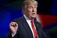 U.S. President Donald Trump gestures as Republican presidential candidate during the Republican National Committee Presidential Primary Debate at the University of Miami's Bank United Center, in USA.
