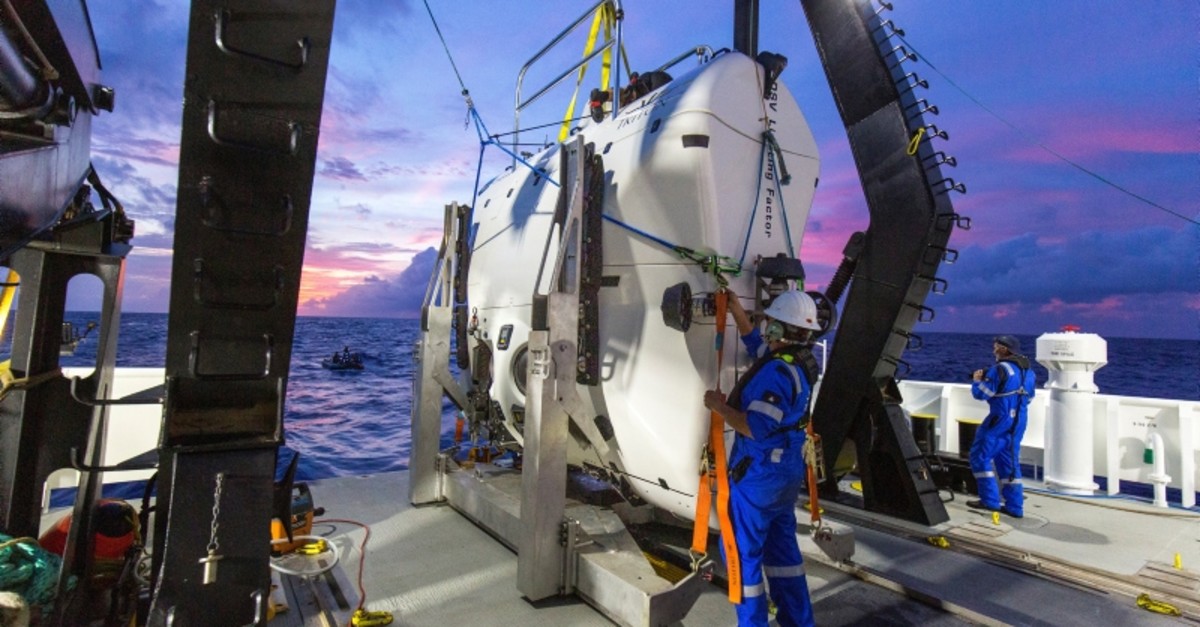 A technician checks the submarine DSV Limiting Factor aboard the research vessel DSSV Pressure Drop above the Pacific Ocean's Mariana Trench in an undated photo released by the Discovery Channel May 13, 2019. (Reuters Photo)