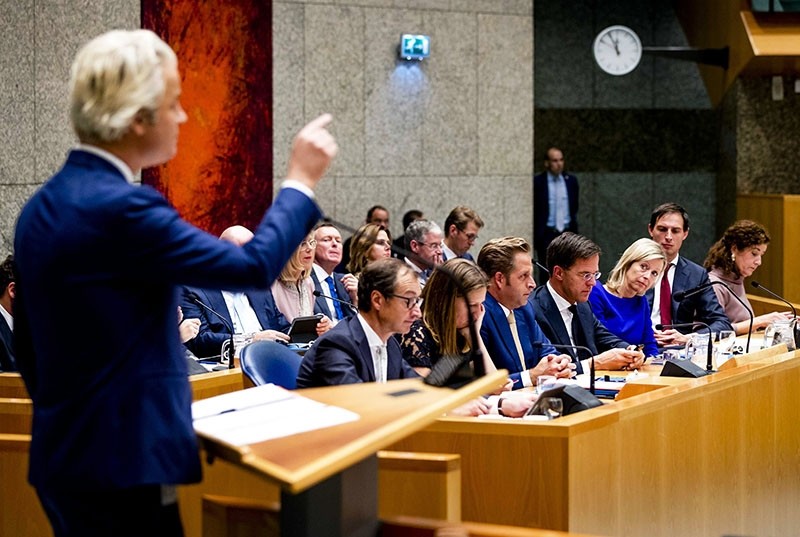 Party for Freedom (PVV) leader Geert Wilders (L) speaks as Dutch Prime Minister Mark Rutte (C) listens during a two-day debate in the Senate in The Hague, The Netherlands, Nov. 01, 2017. (EPA Photo)