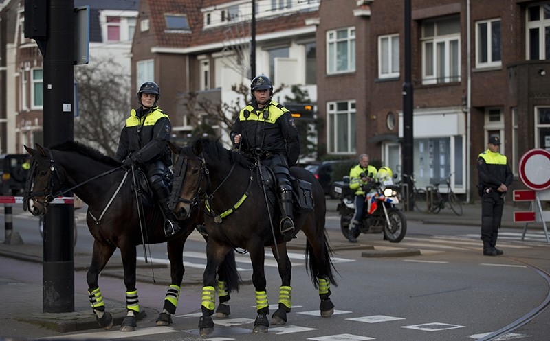 Dutch mounted police patrols as other police officers block the road leading to the Turkish consul's residence in Rotterdam, Netherlands, Saturday, March 11, 2017 (AP File Photo)