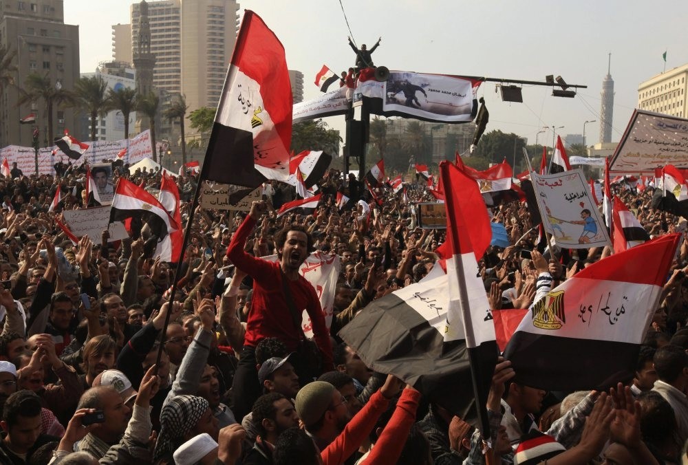 Protesters chant slogans against the Egyptian military council during a demonstration in Tahrir square, Cairo, Nov. 25, 2011. 
