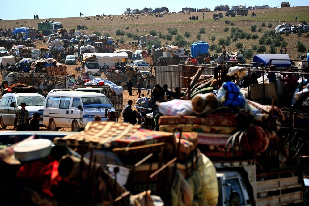 Displaced Syrians gathering at a makeshift camp for displaced people near the northern town of Manbij, March 8.