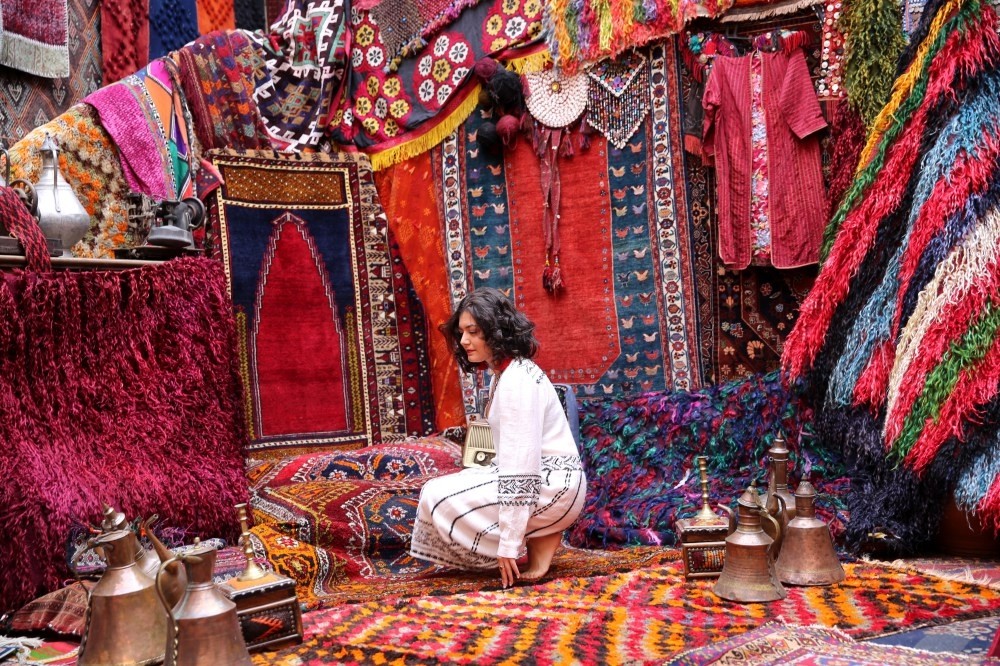 Tourists enjoy shopping at the historical inn while using the venue as their personal photography studio.