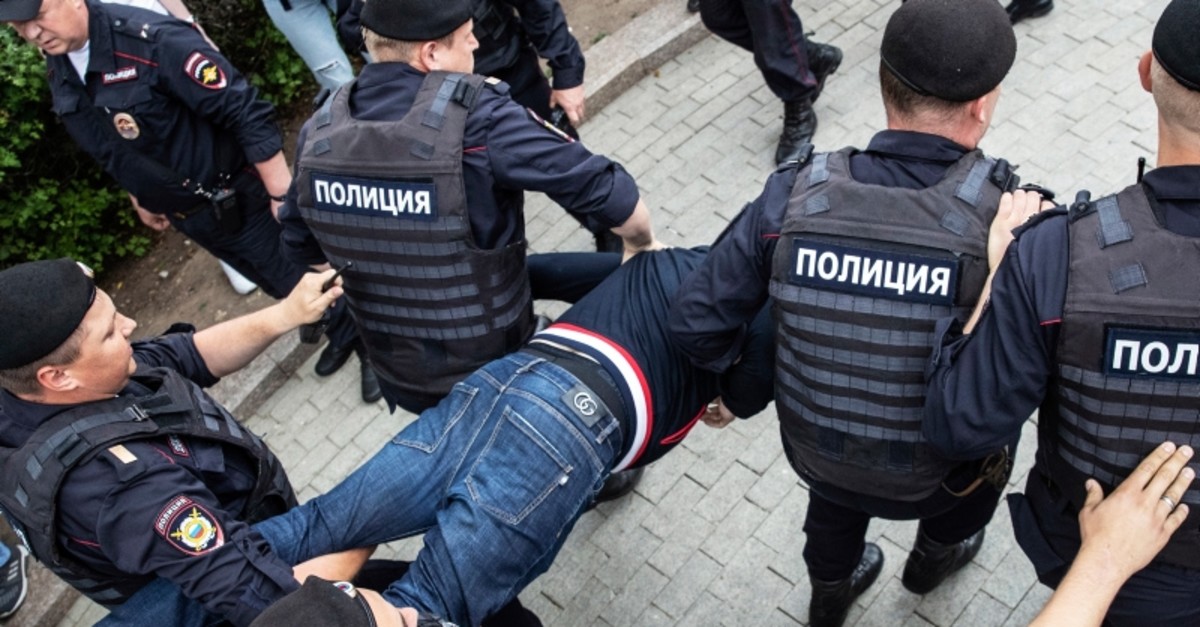 Police officers detain a protester during a march in Moscow, Russia, Wednesday, June 12, 2019. (AP Photo)