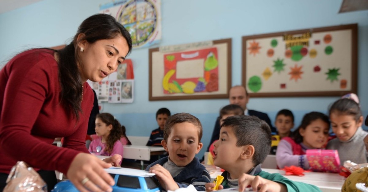 Volunteers gift toys to Syrian and Turkish children studying at village schools in Kilis.