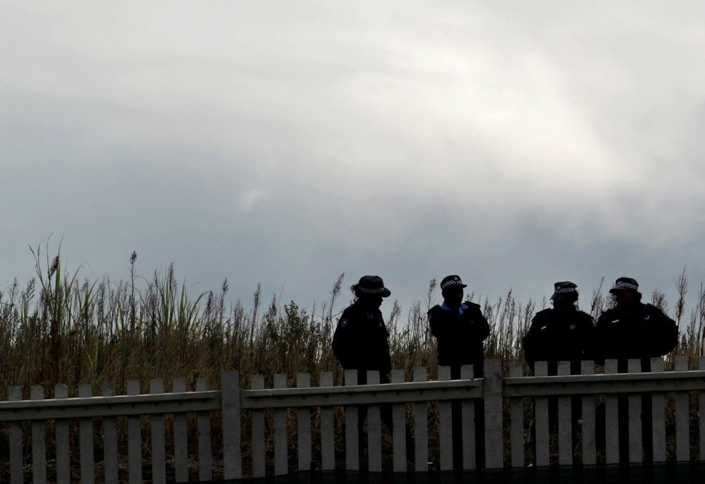 Local police stand guard in Durban, South Africa, Friday, June 11, 2010. (AP Photo)