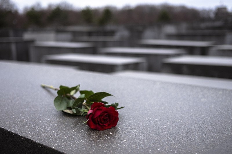 A red rose lies on a slab of the Holocaust Memorial to commemorate the victims of the Nazis in Berlin, Sunday, Jan. 27, 2019. (AP Photo)