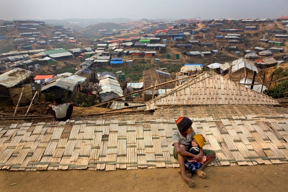A Rohingya boy holds his sibling in the Balukhali refugee camp, Cox's Bazar, Bangladesh, Jan. 15.