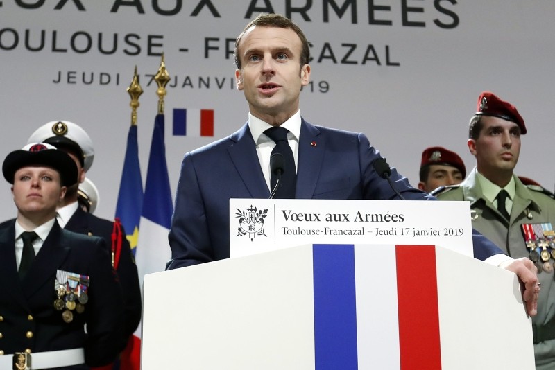 French President Emmanuel Macron delivers his 2019 New Year's wishes to the military forces during his visit of paratroopers of the 11th Parachute Brigade of the Infantry at the air force base 101 Toulouse-Francazal, near Toulouse (AFP Photo)