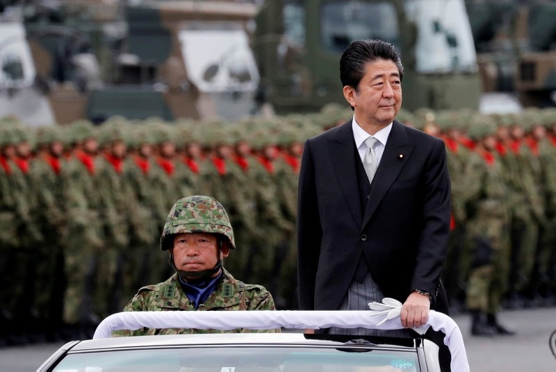 Japanese Prime Minister Shinzo Abe reviews Japanese Self-Defence Forces' (SDF) troops during the annual SDF ceremony at Asaka Base in Asaka, north of Tokyo, Japan, October 14, 2018. (Reuters Photo)